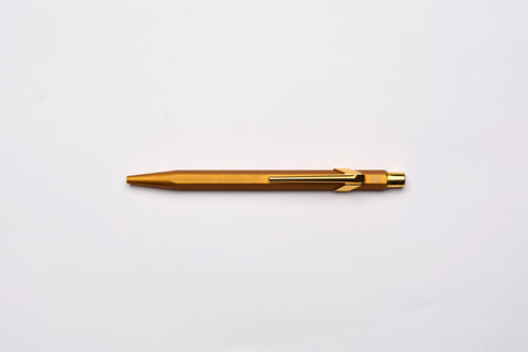 Caran d'Ache 849 Metal Ballpoint Pen - Goldbar With Metal Slim Pack Case