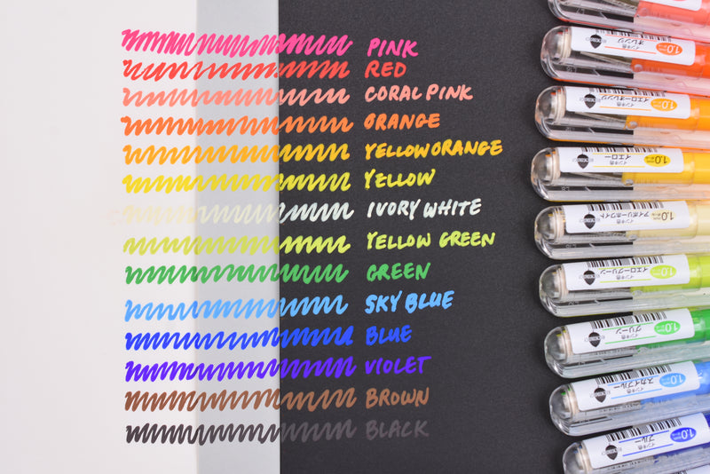Yellow, Orange, Pink, and Blue Coloring Pens on White Notebook